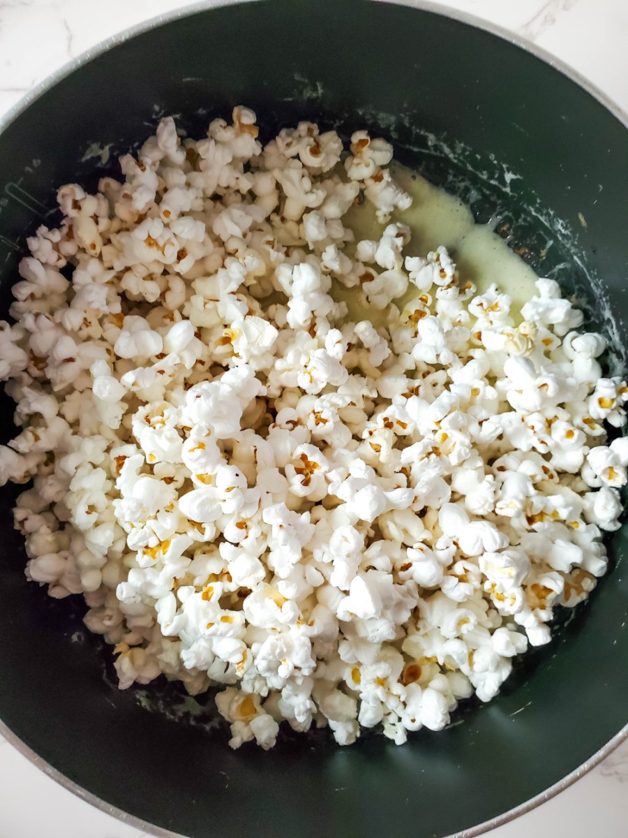 popcorn in marshmallow mixture in large pot