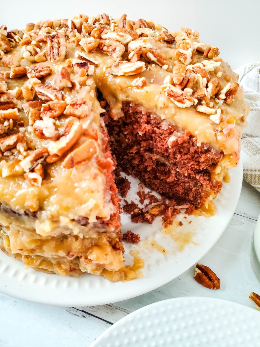 German Chocolate Cake with homemade frosting with slice cut out