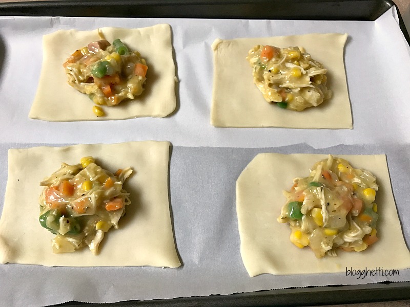 Think of these individual Chicken Pot Pie Hand Pockets as comfort food to go. Handheld pies filled with a creamy chicken pot pie mixture puts dinner on the table in 30 minutes. Perfect for lunches on the go or a fast dinner for busy nights.