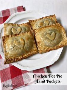 Think of these individual Chicken Pot Pie Hand Pockets as comfort food to go. Handheld pies filled with a creamy chicken pot pie mixture puts dinner on the table in 30 minutes. Perfect for lunches on the go or a fast dinner for busy nights.