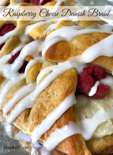 This Raspberry Cheese Danish Braid is so easy to make and it starts with a can of crescent dough. The danish is filled with cream cheese and fresh raspberries and then topped with a sweet glaze. Change up the fruit with your any of your favorites or a combination.