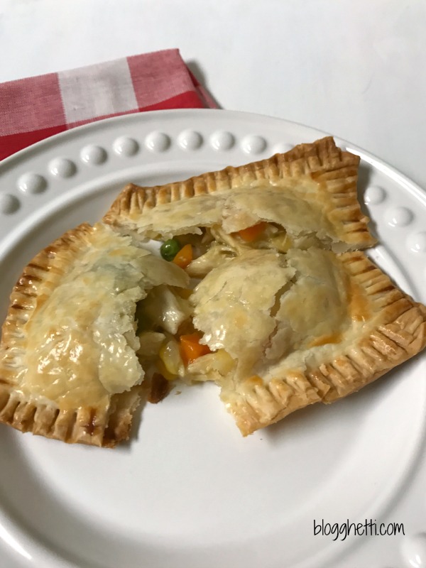 Think of these individual Chicken Pot Pie Hand Pockets as comfort food to go. Handheld pies filled with a creamy chicken pot pie mixture puts dinner on the table in 30 minutes. Perfect for lunches on the go or a fast dinner for busy nights.