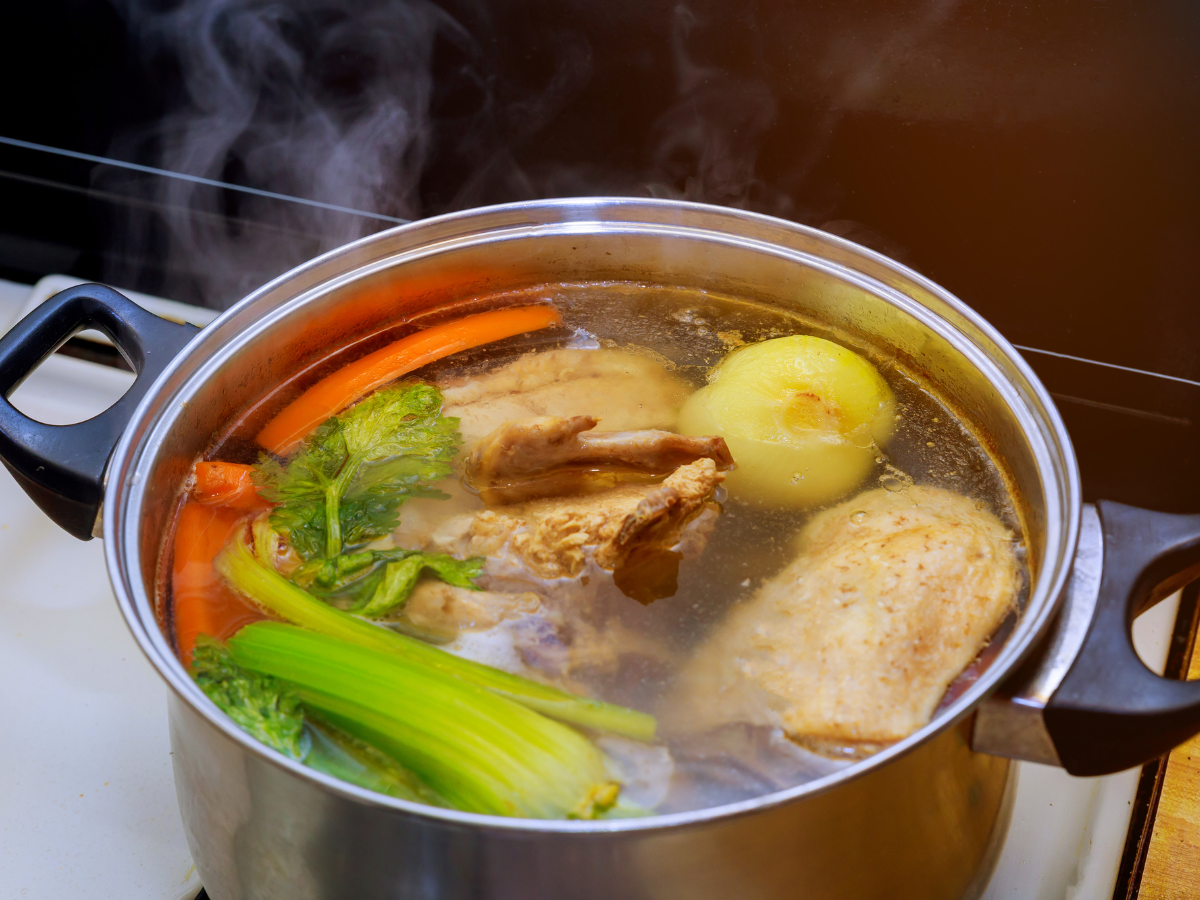 chicken stock cooking in large pot