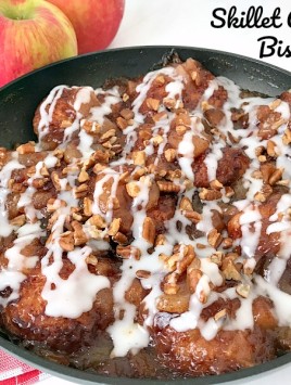 This Skillet Apple Pie Biscuit recipe will quickly become a family favorite. All of the flavors you love in apple pie but with biscuits and a sweet glaze on each and every one of the apple pie biscuits.