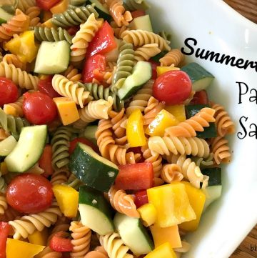 This Summertime Pasta Salad is colorful, fresh and full of flavor from all of the vegetables and the zesty dressing. Not to mention, it's quick to make and is perfect for your next picnic or cookout.