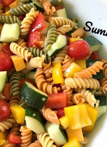 This Summertime Pasta Salad is colorful, fresh and full of flavor from all of the vegetables and the zesty dressing. Not to mention, it's quick to make and is perfect for your next picnic or cookout.