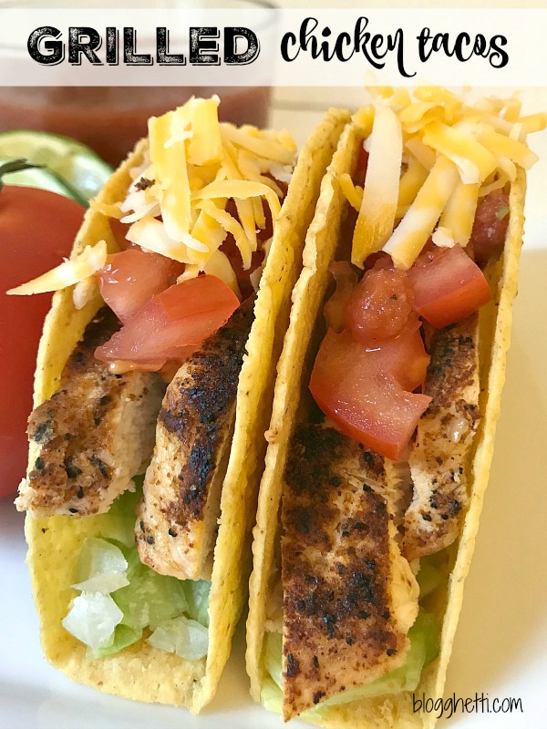 Two Grilled Chicken Tacos with cheese, lettuce, and tomatoes
