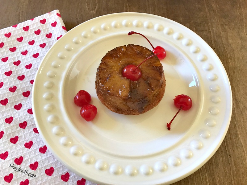 These Jumbo Upside-Down Pineapple Muffins are sweet and simple to make from scratch. Topped with a brown sugar glaze, pineapple ring, and a maraschino cherry they make the perfect sweet treat.