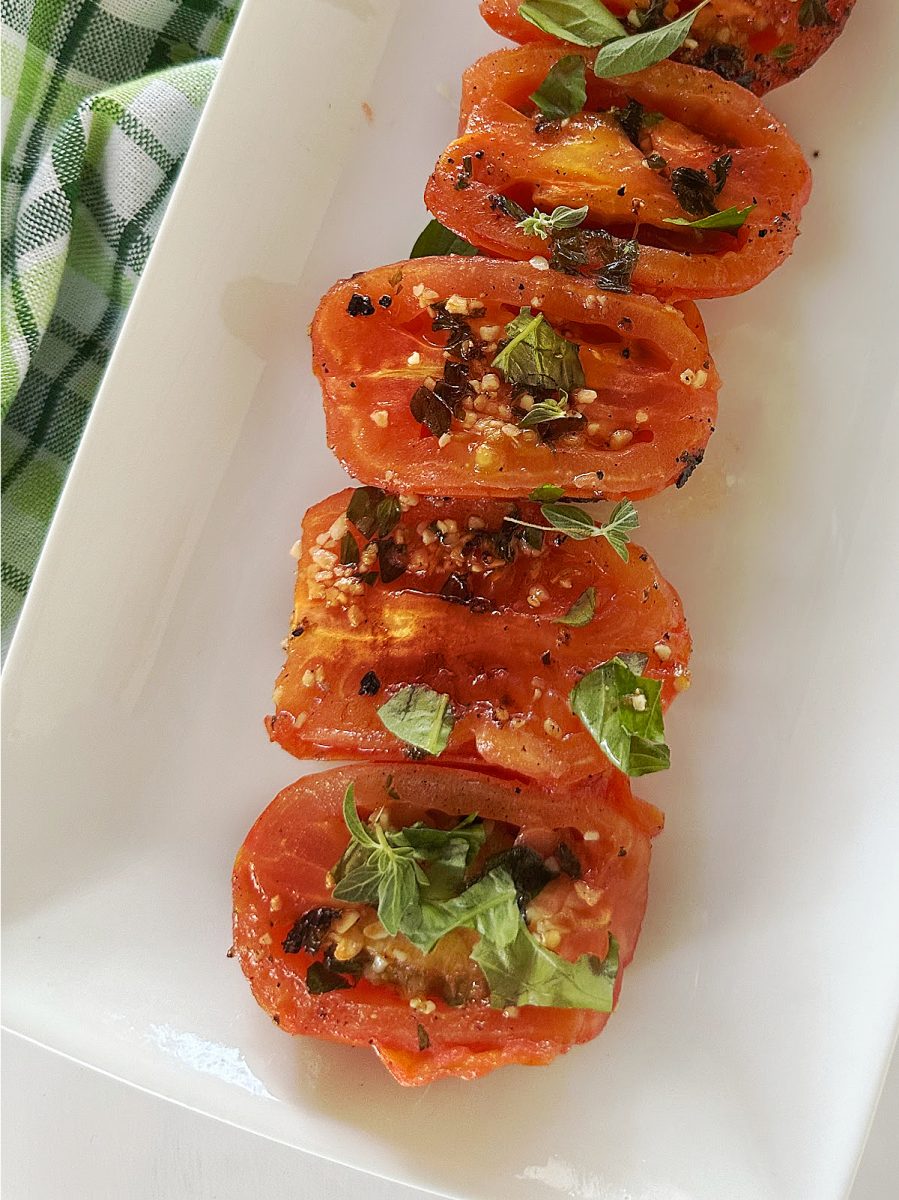 garlic and herb roasted tomatoes on plate