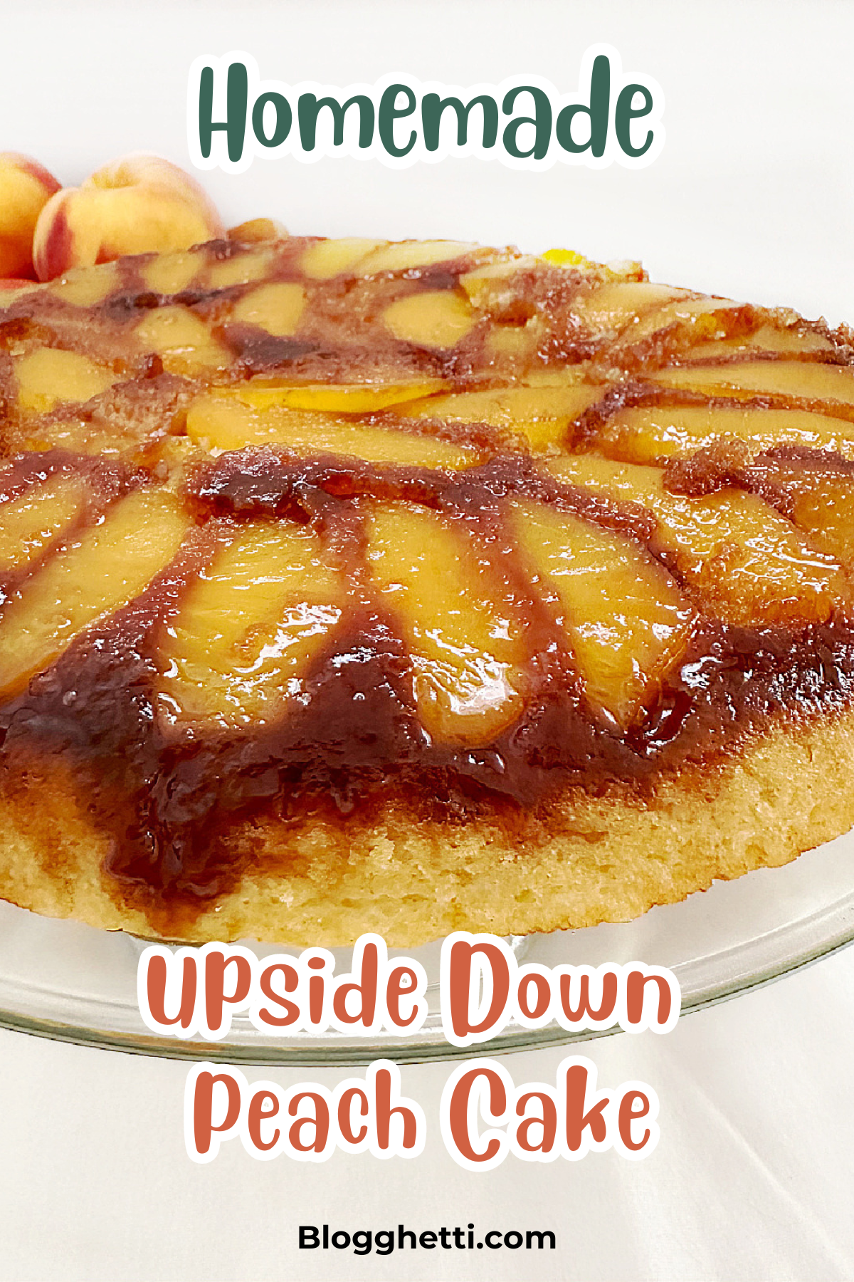 A golden, caramelized homemade upside-down peach cake displayed on a glass plate. The top features slices of fresh peaches arranged in a glossy caramel glaze. The text 'Homemade Upside Down Peach Cake' is overlaid on the image,