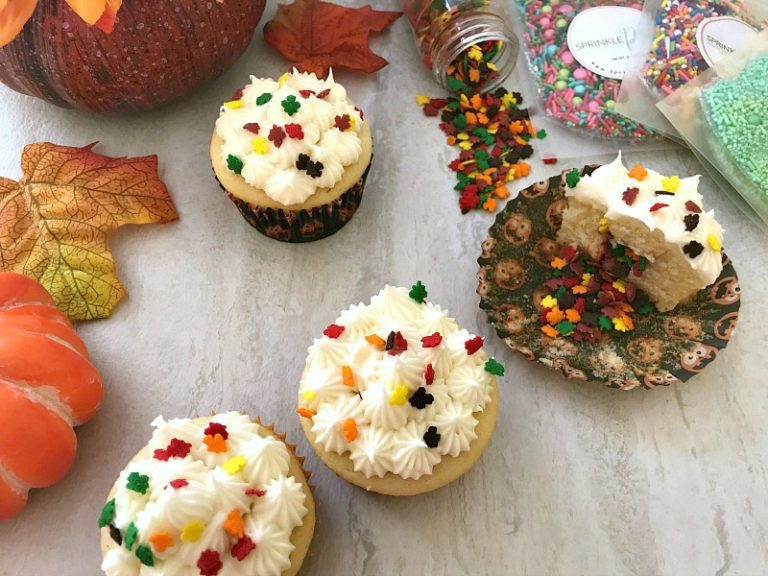 Festive Fall Piñata Cupcakes with White Chocolate Frosting