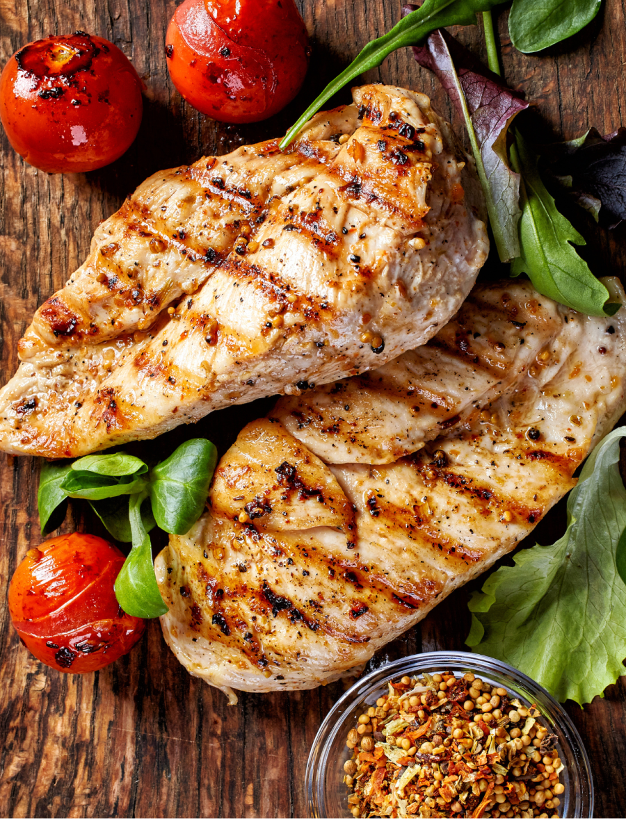 grilled chicken on wooden board
