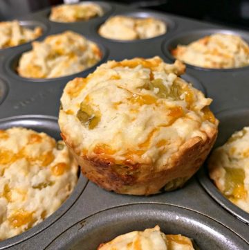 These tasty cheesy chili muffins are baked with sharp cheddar cheese and green chiles and are perfect to serve along side chili or a Tex-Mex meal. #cheese #muffins #chili #pinterestchallenge.