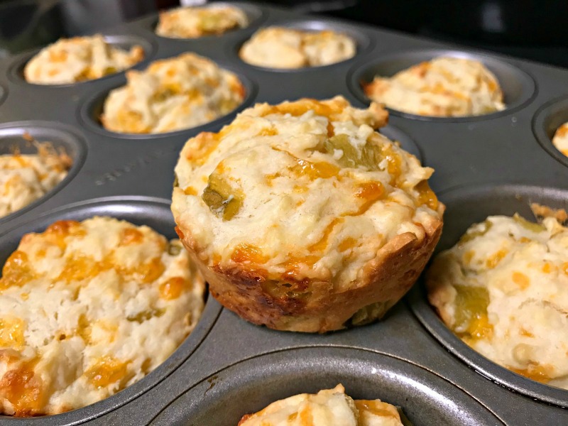 These tasty cheesy chili muffins are baked with sharp cheddar cheese and green chiles and are perfect to serve along side chili or a Tex-Mex meal. #cheese #muffins #chili #pinterestchallenge. 