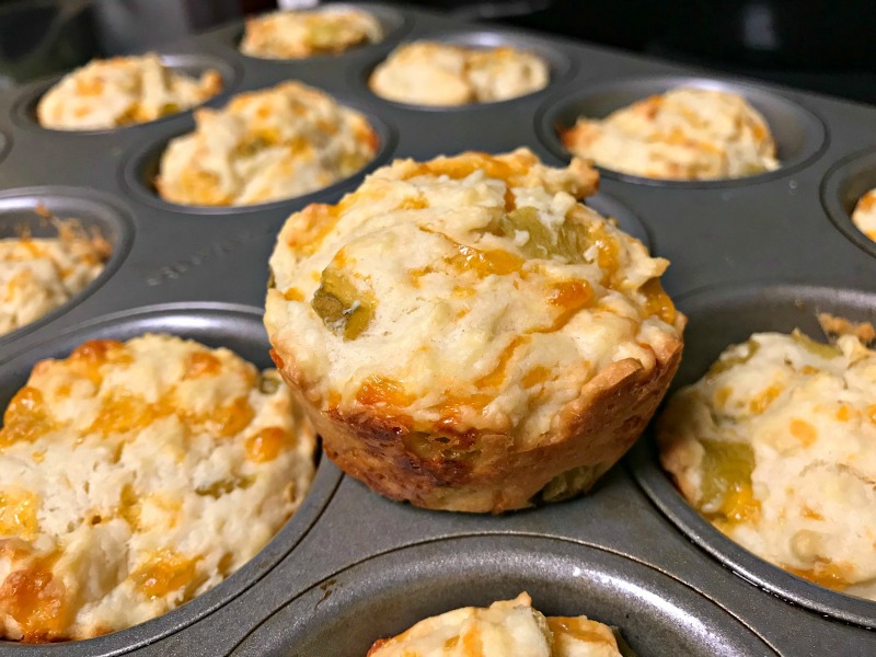 These tasty cheesy chili muffins are baked with sharp cheddar cheese and green chiles and are perfect to serve along side chili or a Tex-Mex meal. #cheese #muffins #chili #pinterestchallenge.