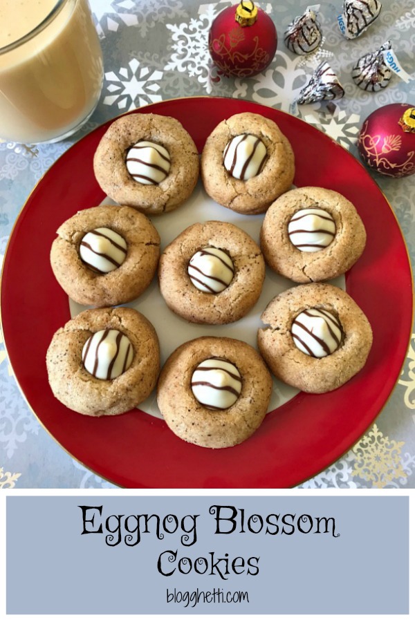 These Eggnog Blossoms are a festive addition to your holiday cookie trays. The cookies are soft, chewy, and full of traditional eggnog flavors with a white chocolate kiss in the center. #ChristmasSweetsWeek #sponsored #eggnog #cookies 