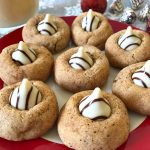 These Eggnog Blossoms are a festive addition to your holiday cookie trays. The cookies are soft, chewy, and full of traditional eggnog flavors with a white chocolate kiss in the center. #ChristmasSweetsWeek #sponsored #eggnog #cookies
