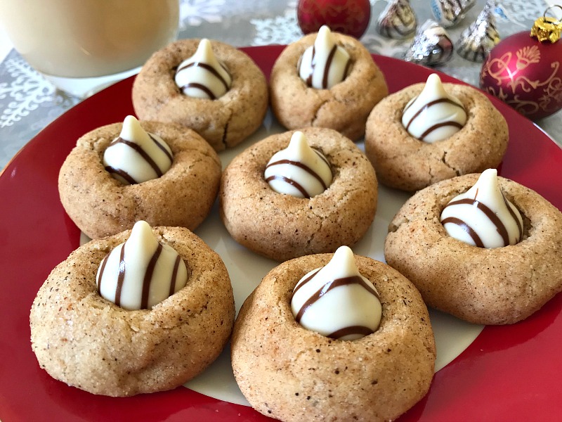 These Eggnog Blossoms are a festive addition to your holiday cookie trays. The cookies are soft, chewy, and full of traditional eggnog flavors with a white chocolate kiss in the center. #ChristmasSweetsWeek #sponsored #eggnog #cookies 