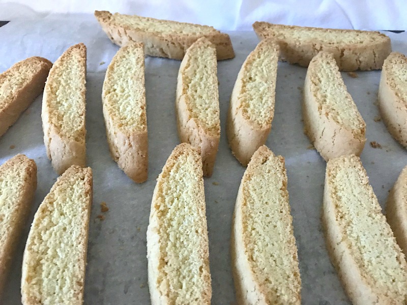 Italian Anise Biscotti gets a festive holiday makeover with colorful sprinkles. Whether you dunk this twice-baked cookies into your coffee or tea, or simply enjoy them as a treat, you'll get that classic anise flavor in each bite with bonus white chocolate drizzle. #ChristmasSweetsWeek #ad #biscotti #cookies #anise #Christmas #sprinkles 