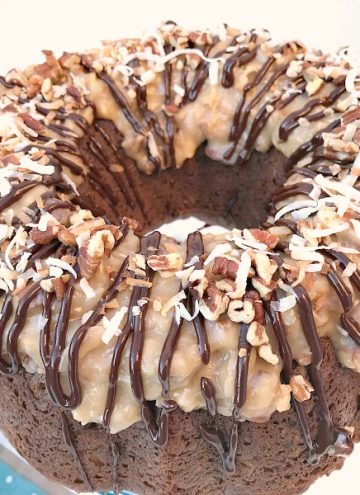 This German Chocolate Bundt Cake with a Homemade Coconut Frosting is moist, decadent, and does not disappoint. Perfect cake to celebrate any special occasion. #GermanChocolateCake #cake #chocolate