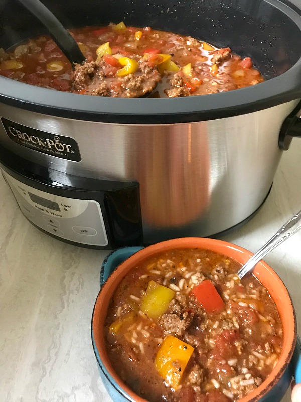 Slow Cooker Stuffed Pepper Soup is a hearty meal loaded with everything you love about a classic stuffed pepper - ground beef, rice and bell peppers, all in a tomato-based broth. #soup #stuffedpeppers #slowcooker #OurFamilyTable