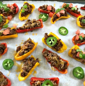 These Mini Bell Pepper Nachos are an easy low-carb, gluten-free way to get your nacho fix. Perfect for game day snacking or eating while binge watching TV. #nachos #bellpeppers #footballfood #gameday #snacks