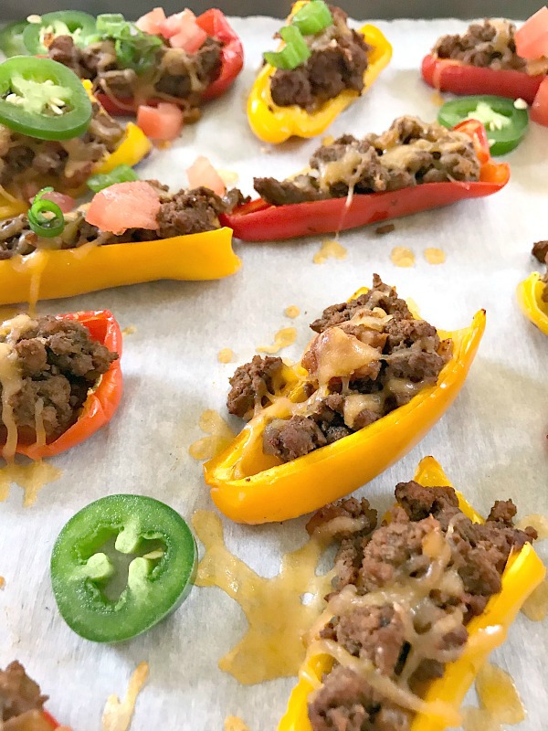 These Mini Bell Pepper Nachos are an easy low-carb, gluten-free way to get your nacho fix. Perfect for game day snacking or eating while binge watching TV. #nachos #bellpeppers #footballfood #gameday #snacks