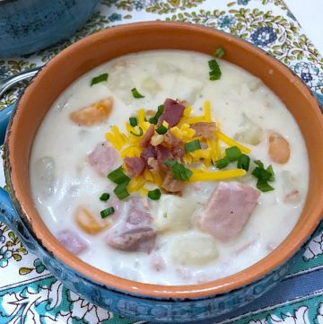 This Slow Cooker Creamy Potato and Ham Soup is hearty, delicious, and easy to make. Comfort food that is loaded with ham, potatoes, and veggies all slow cooked in a tasty and creamy broth. #slowcooker #crockpot #soup #potato #ham