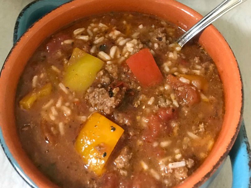 Slow Cooker Stuffed Pepper Soup is a hearty meal loaded with everything you love about a classic stuffed pepper - ground beef, rice and bell peppers, all in a tomato-based broth. #soup #stuffedpeppers #slowcooker #OurFamilyTable