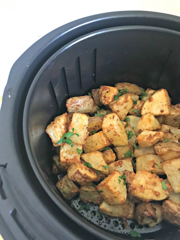 Air Fryer Garlic Parmesan Roasted Potatoes are a quick and simple side dish ready in 20 minutes, perfect with dinner or breakfast. #airfryer #potatoes #roasted #garlic #parmesan