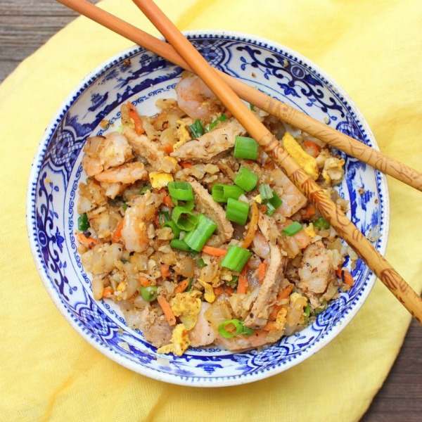 Chinese Pork and Shrimp Fried Cauliflower rice in a blue and white bowl 