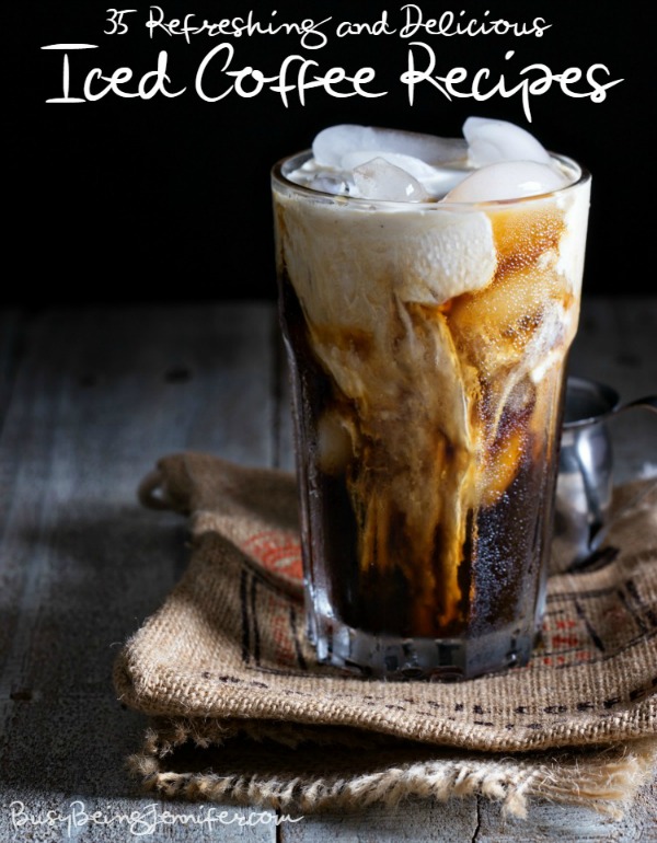 Iced coffee in a tall glass with cream poured over