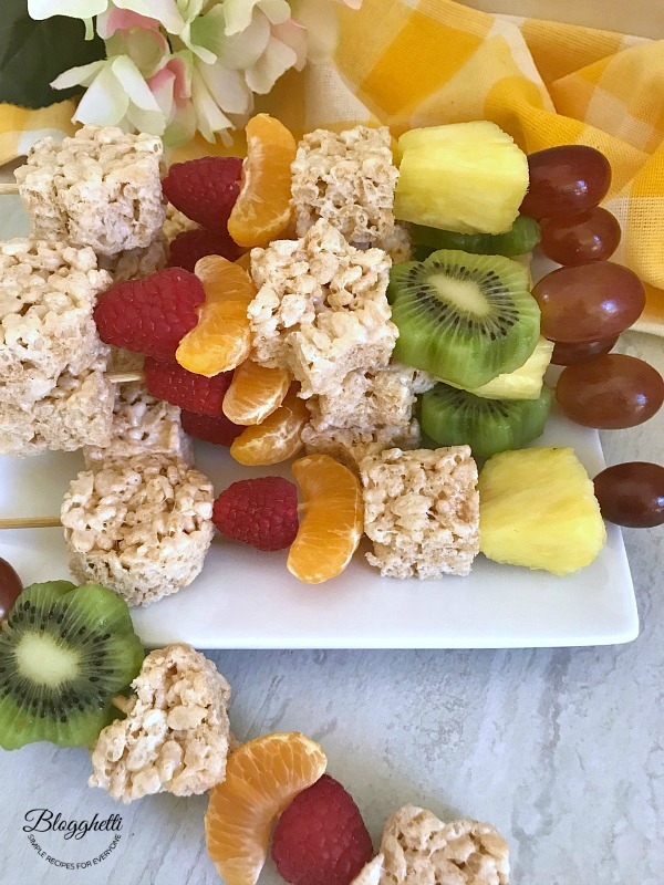 close up of rice krispie treat and fruit kabobs