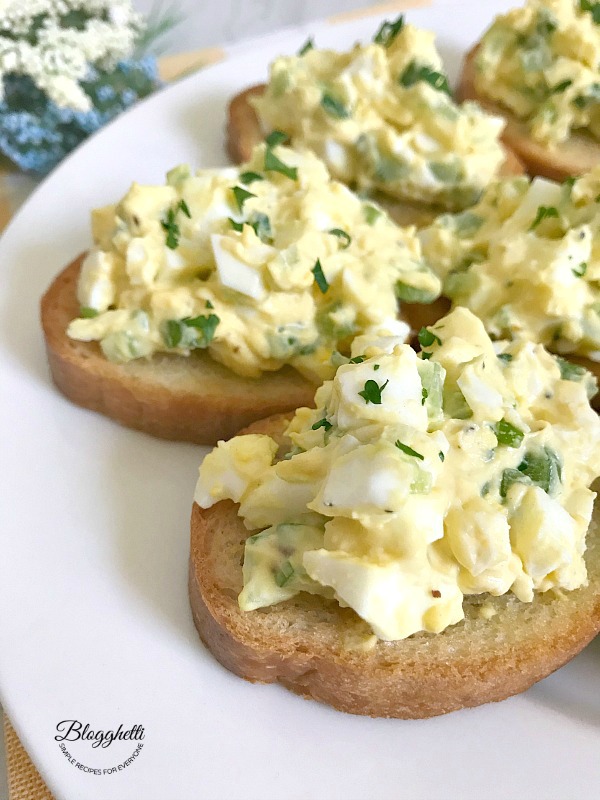 Deviled Egg Crostini on a white plate