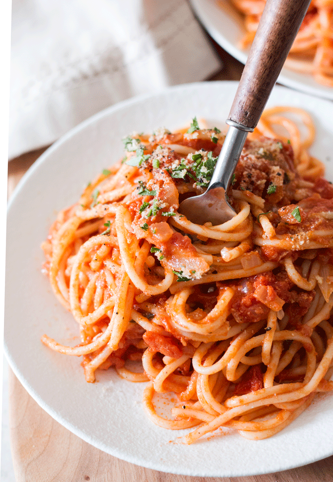 white plate with a serving of Vegan Cream Tomato Sauce and Spaghetti