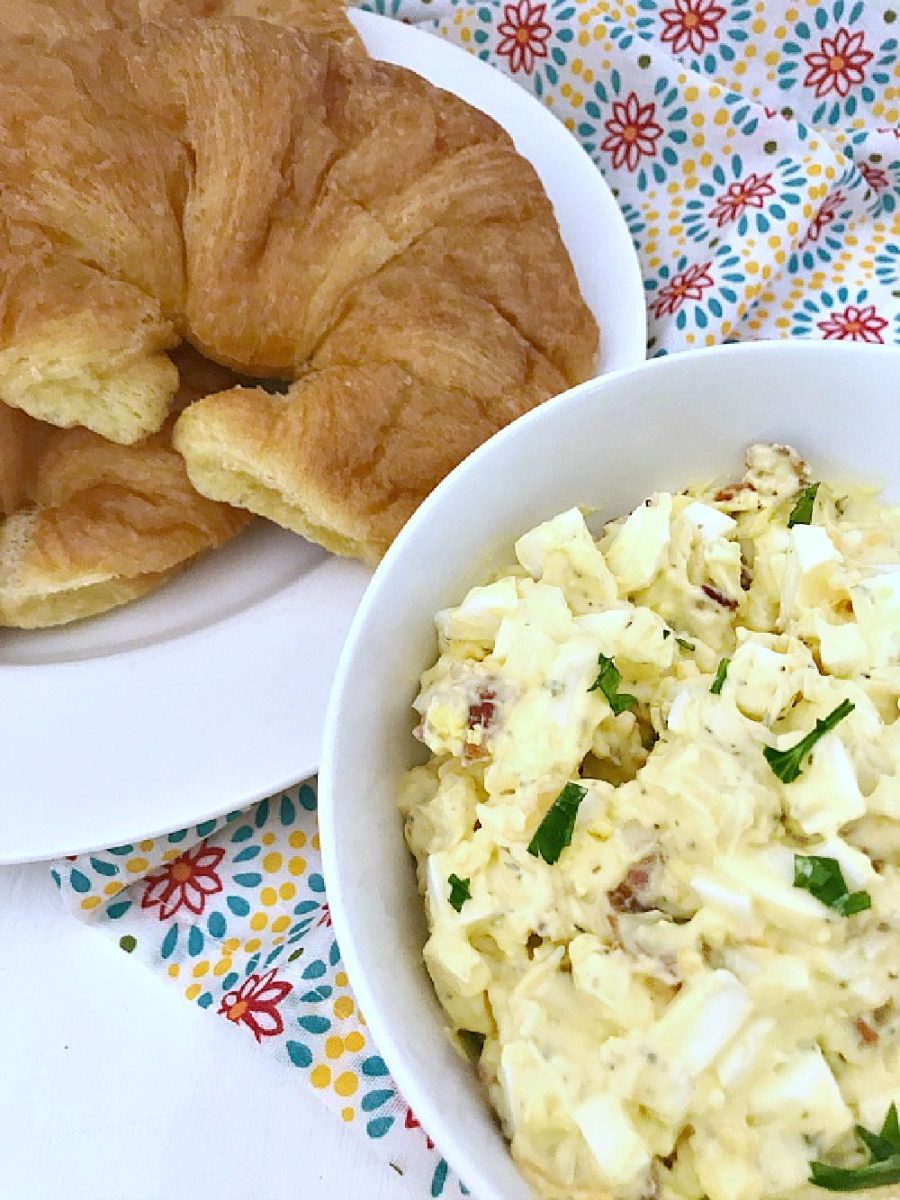 close up of bacon and cheddar egg salad with croissants