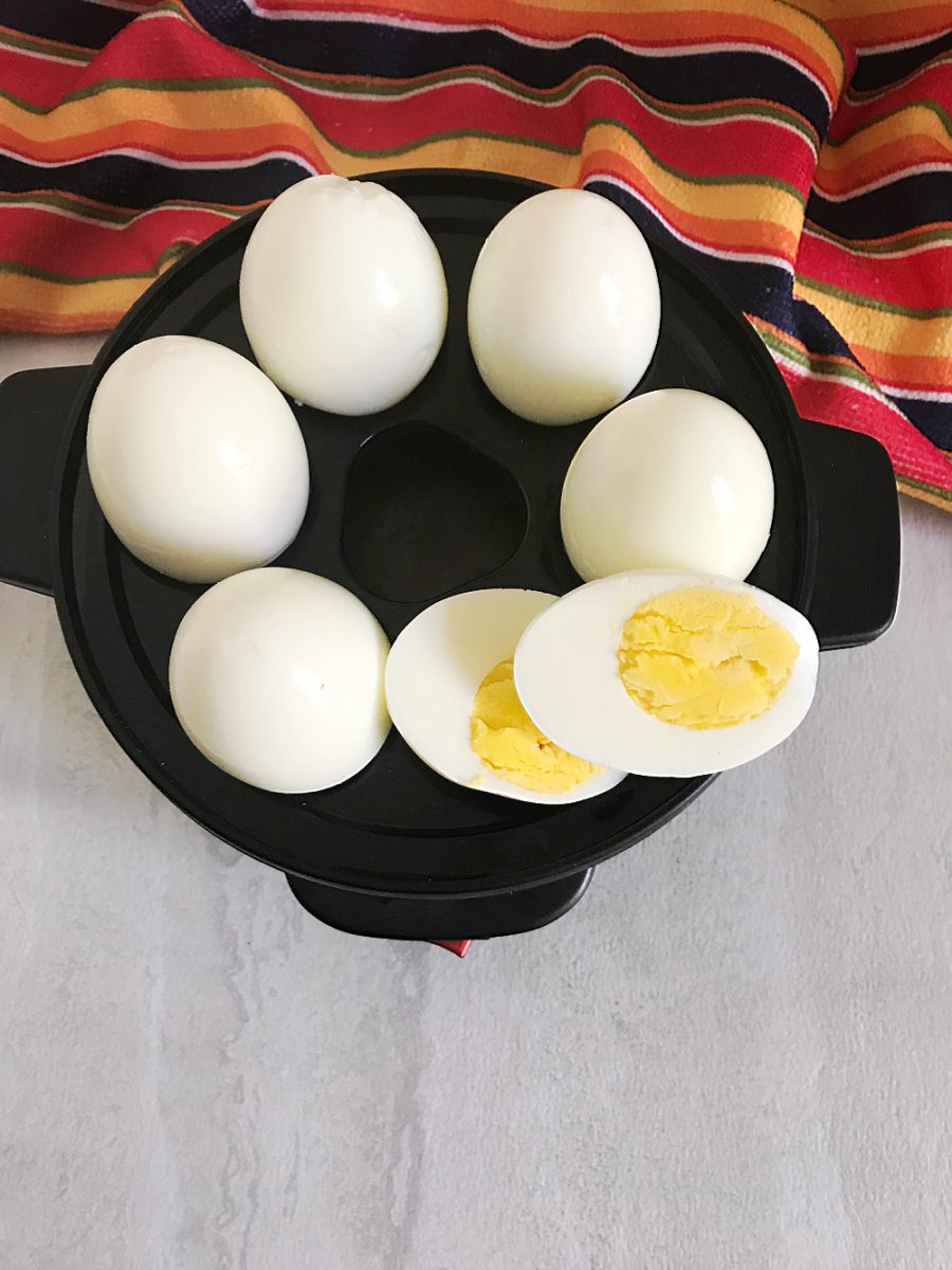 hard boiled egg cut in half in egg cooker