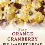 Pinterest graphic featuring a close-up of glazed orange cranberry pull-apart bread made with frozen bread dough, fresh orange zest, and dried cranberries. The design includes ingredient callouts and "Real Recipe • Real Kitchen."