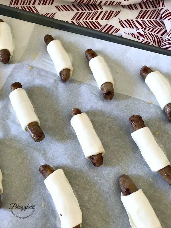 sausage wrapped in pastry puff dough ready to bake