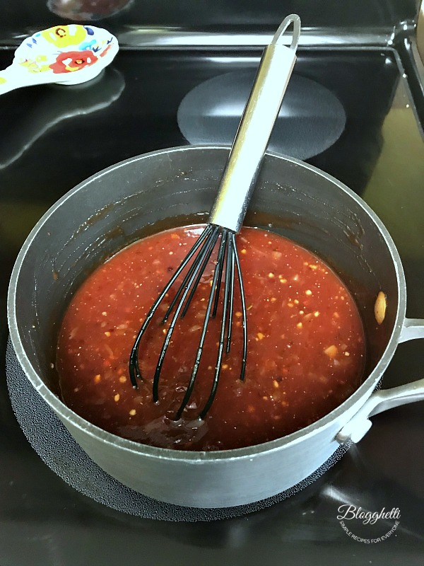 Cooking Cherry Bourbon BBQ Sauce on the stove top