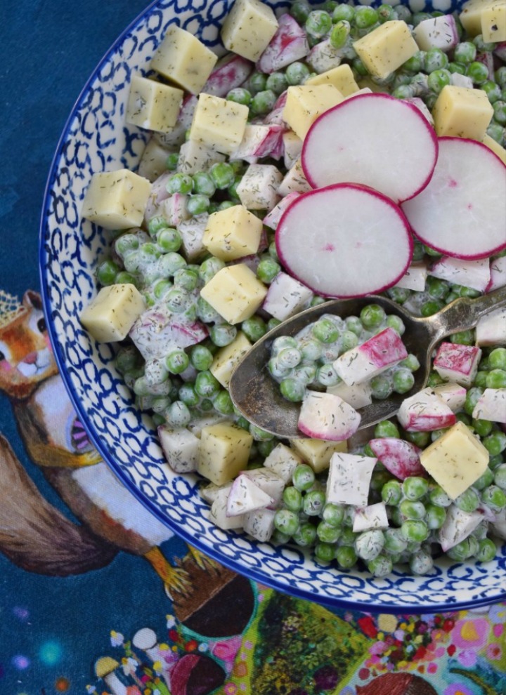 Baby Sweet Pea & Radish Salad on a blue and white plate