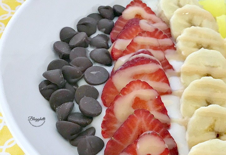 Banana Split Smoothie Bowl - close up with Barlean's Omega Pals drizzled over top