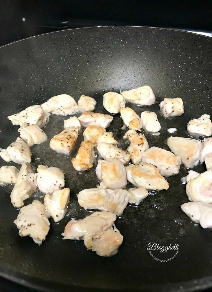 Browning chicken in skillet for Lemon chicken orzo recipe