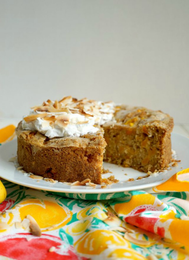 vegan mango coconut snack cake on cake plate