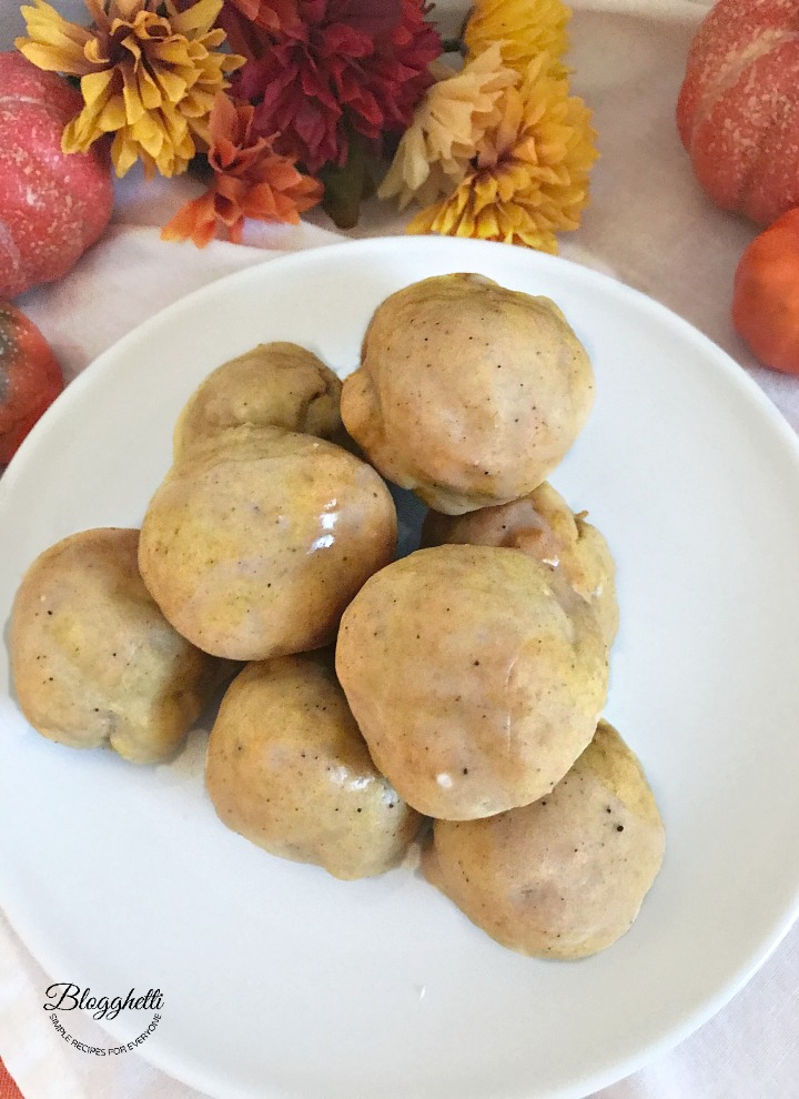 Air Fryer Pumpkin Spice Donut Holes stacked on white plate