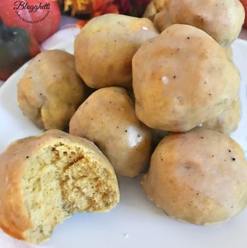 Air fryer Pumpkin Spice Donut Holes with a bite out of one