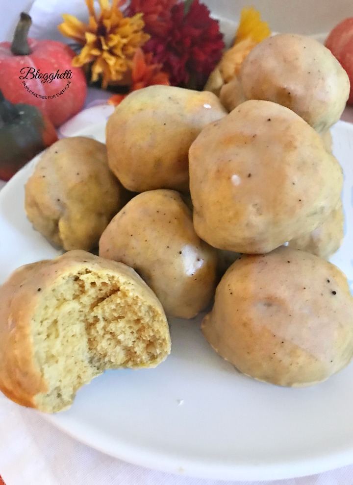 Air fryer Pumpkin Spice Donut Holes with a bite out of one