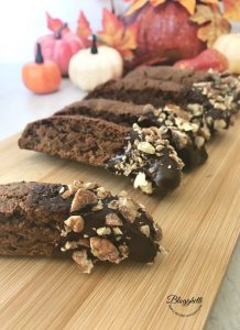 Cappuccino Biscotti with Pecans with fall pumpkins in the background