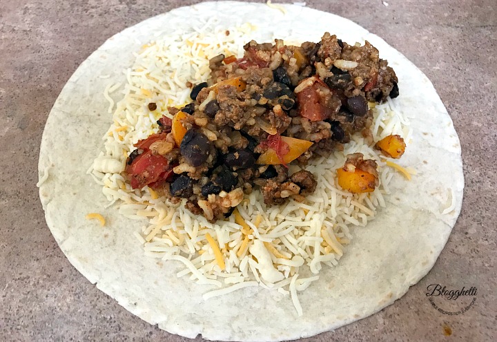 Preparing the wraps with southwestern filling