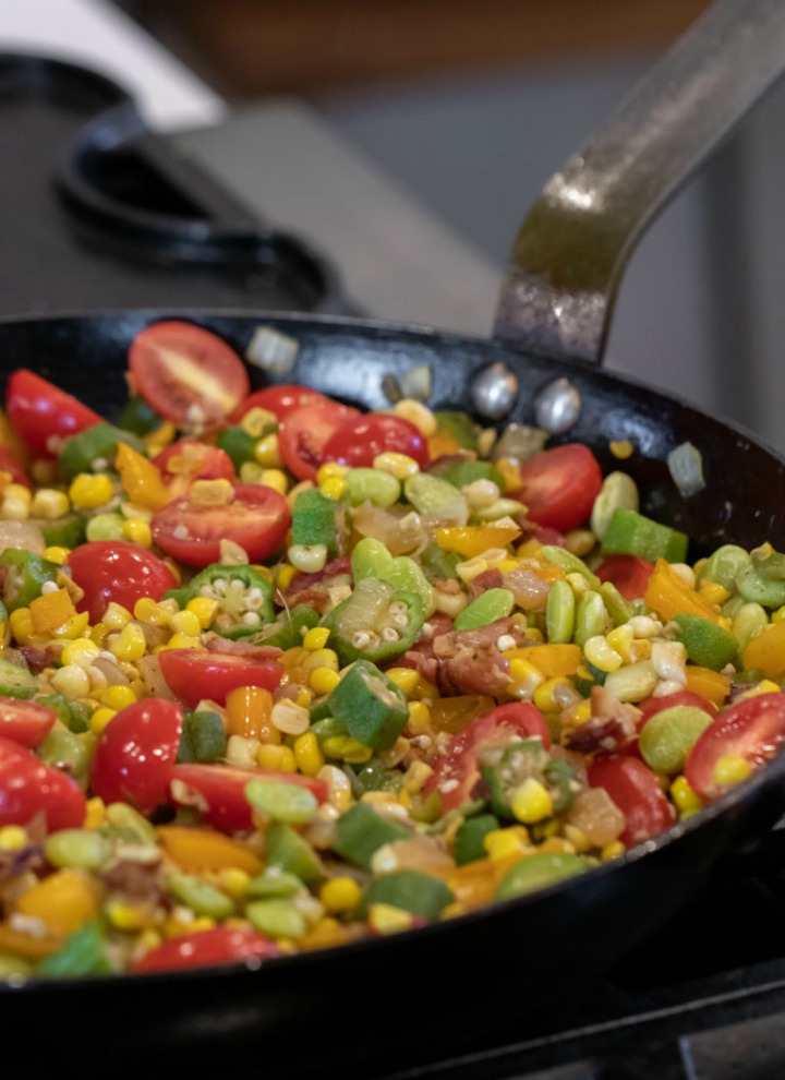 skillet with succotash, bacon, okra and tomatoes